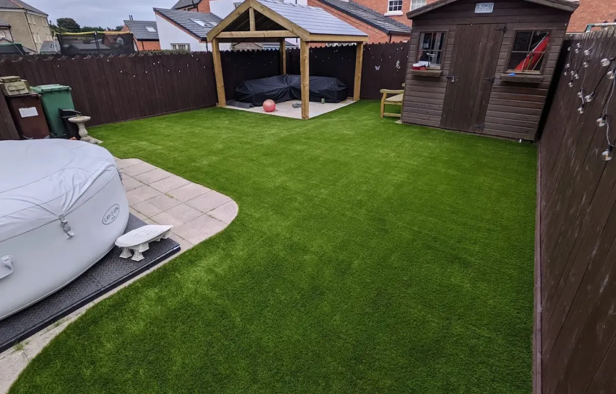Artificial grass lawn completed by Guildford Driveways & Patios